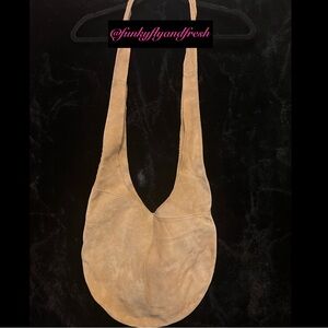 Suede tan crossbody boho purse. Holds a lot & is very sturdy.